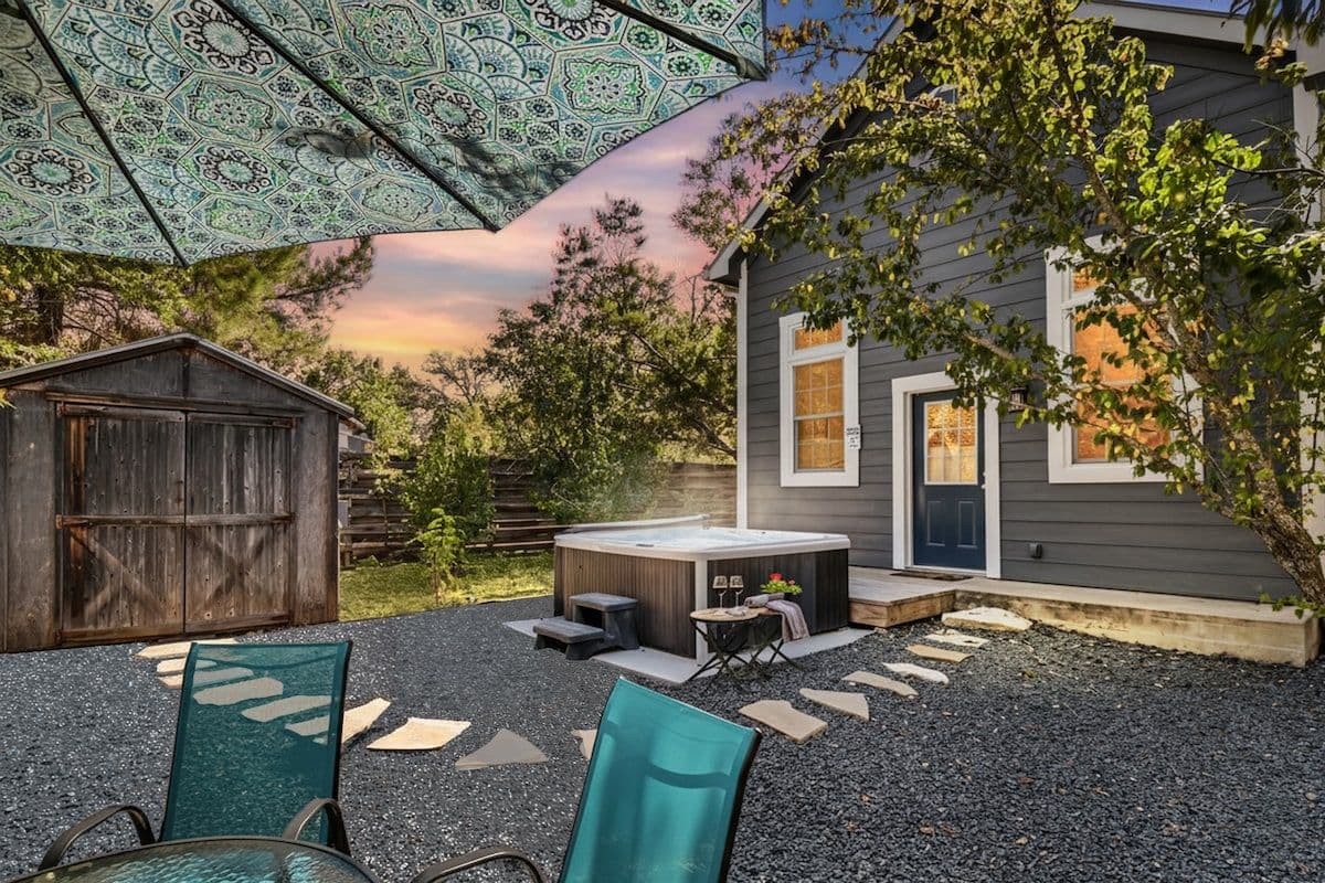 Guest Cottage exterior and patio at dusk